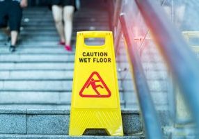 Slip-and-fall accidents can result from someone not doing their job, a wet floor, a cracked sidewalk left unattended for months, or a stairwell light not replaced.