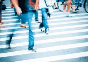 Pedestrians and bicyclists cross a busy intersection in New Jersey